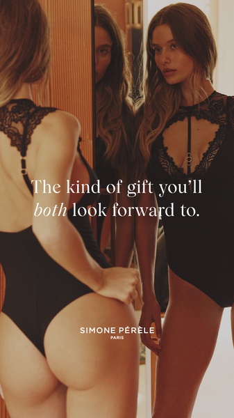 A high-end portrait of a model in intimate apparel looking into a mirror, using a double-exposure aesthetic to create an intimate, aspirational mood.